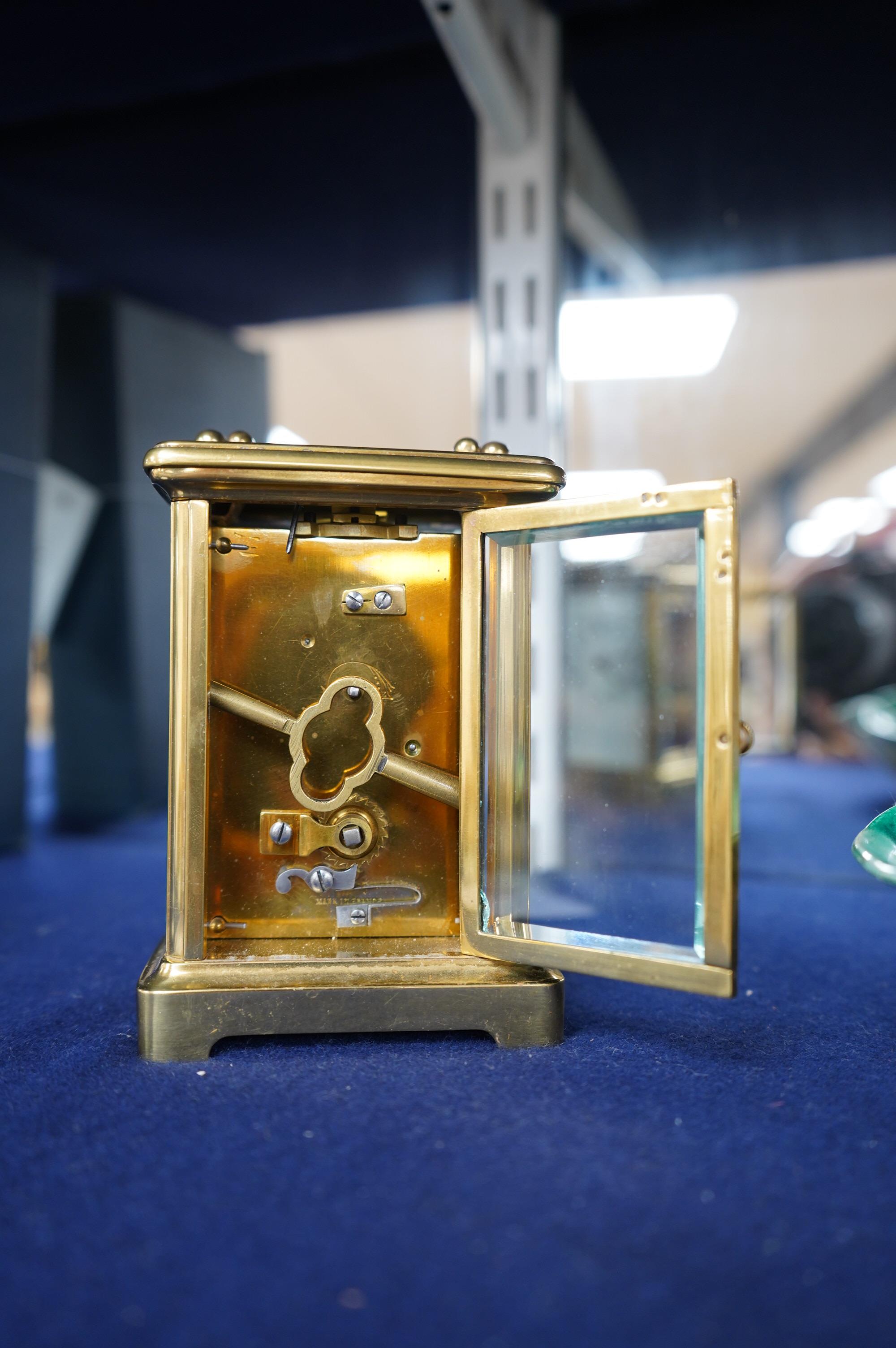 A brass carriage timepiece, 11.5cm high. Condition - good.